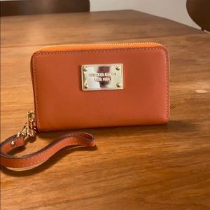 Michael Kora orange wristlet